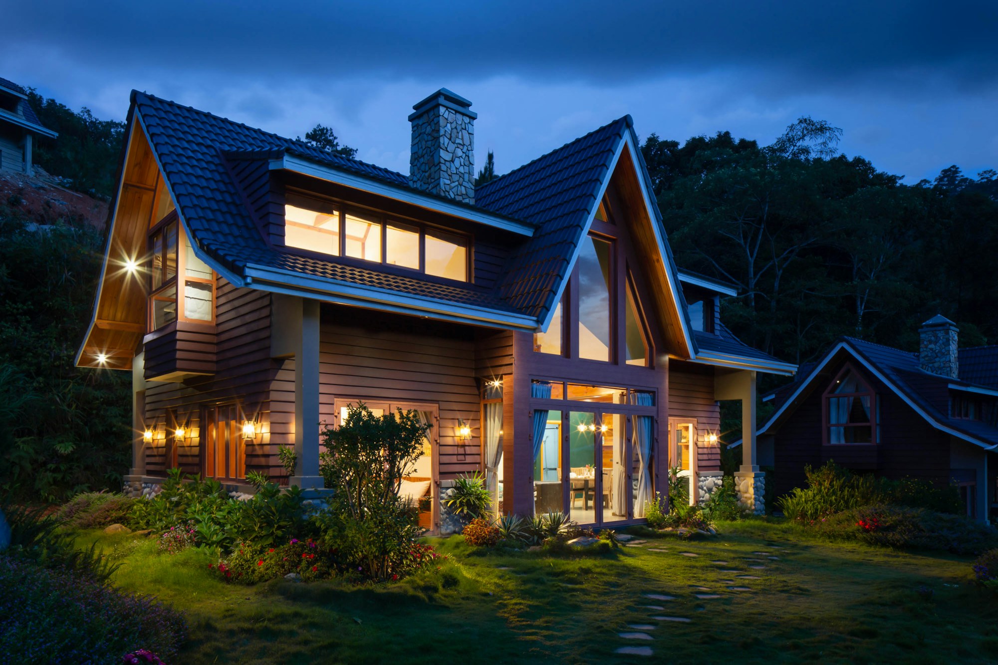 A luxury Los Angeles home glowing at dusk